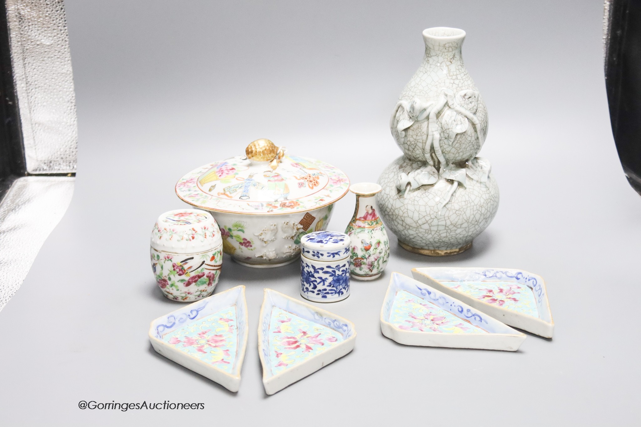 A quantity of mixed Chinese ceramics to include a crackleglaze double gourd vase, three pieces of famille rose porcelain, a blue and white pot and cover, etc. tallest 22cm